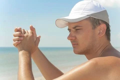 Guy sits on the beach Stock Photos