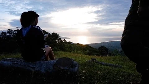 The guy sits down to his girlfriend. Video stock 122985559