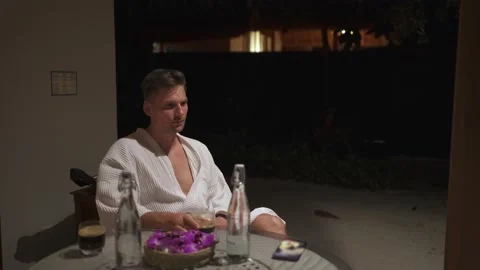 The guy sits on the veranda Stock Footage 146706817