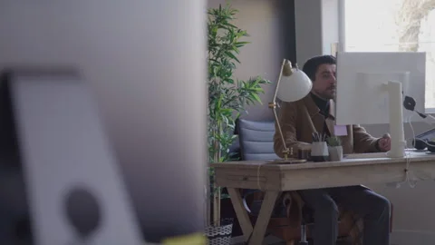 Guy Sits Working At Desk In Office Stock Footage 270334528