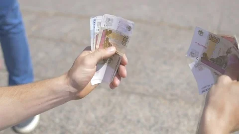Guy is sitting and counting the money Stock Footage 81810457