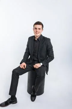 The guy sitting on the barrel. The guy in the Studio. The guy in the black su Stock Photos