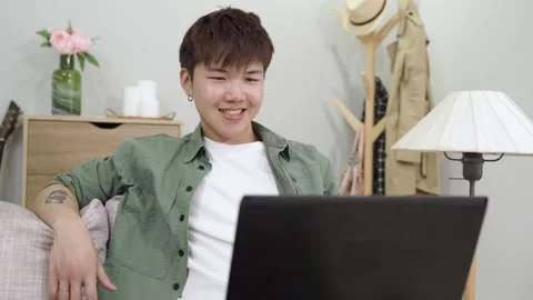 Guy sitting behind laptop is looking at screen Video stock 161813079