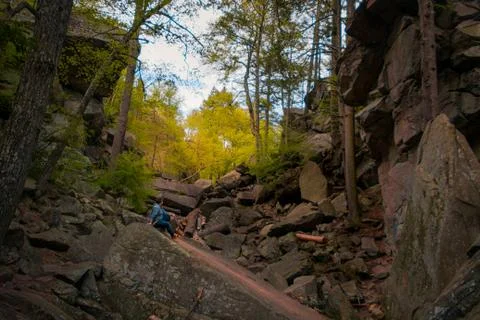 Guy Sitting in Canyon Stock Photos