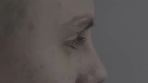 The guy is sitting at the table by the laptop. The guy writes, draws. Stock Footage 130219181