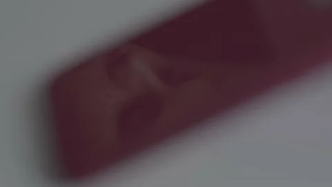 The guy is sitting at the table by the laptop. The guy writes, draws. Stock Footage 130219687