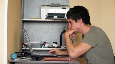 Guy sitting table working laptop. Remote work during quarantine Stock Footage 127394925