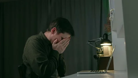 The guy sitting at the workplace coughs, is sick. Stock Footage 168899417