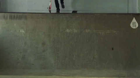 A guy on a skateboard moves down from the ramp Stock Footage 61239019