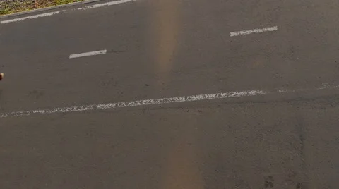 A guy on a skateboard rides on the road. View from above Stock Footage 64743047