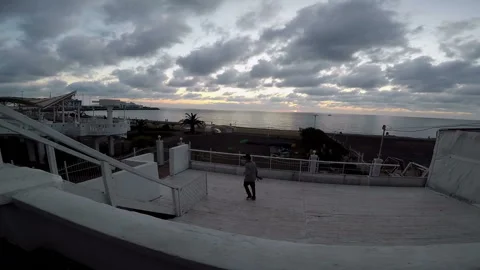 Guy with the skateboard rises up the stairs Video stock 93939740
