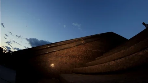 The guy on the skateboard slides on the brink at sunset Video stock 71781796