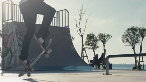 The guy skates on a ramp. Skateboarder Doing a Jump at a Concrete Skate Park. 스톡 동영상 194252045