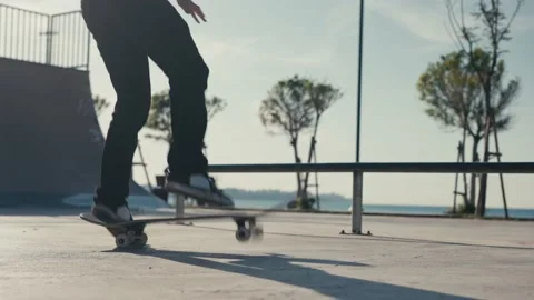 The guy skates on a ramp. Skateboarder Doing a Jump at a Concrete Skate Park. Video stock 194495245
