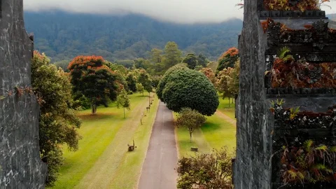 The guy skates through the gates to paradise in Bali Stock Footage 125994284