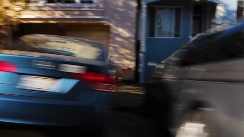 Guy skating down hill at high speed as cars fly past. Professional skater Stock Footage 99316514