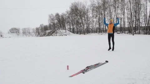 Guy skier doing exercises for body Stock Footage 86330988