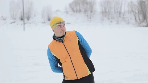 Guy skier doing exercises before check-in Stock Footage 86055544