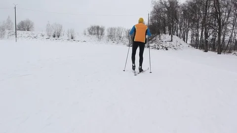 Guy skier in the snow-covered forest Stock Footage 86330041