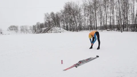 Guy skier warms up before arrival Stock Footage 86331246