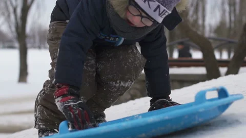 Guy sledding in the winter Stock Footage 102317189