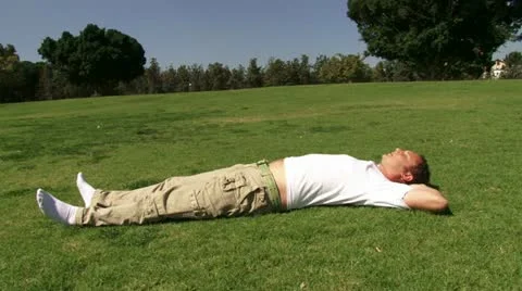 Guy sleeping over the grass Stock Footage 20510349