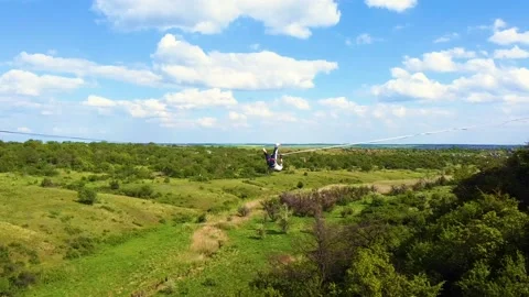 The guy on the sling is engaged in slack-line Stock Footage 131848584