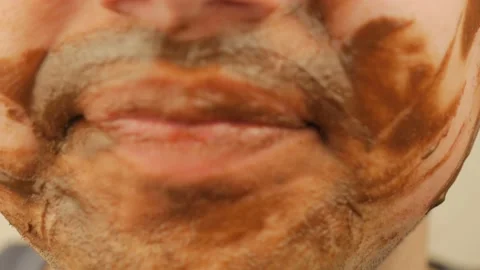 The Guy Smeared His Face With Chocolate Stock Footage 151218920