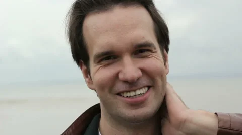Guy  Smile and Laughs on Camera Ocean Background 스톡 동영상 53834927
