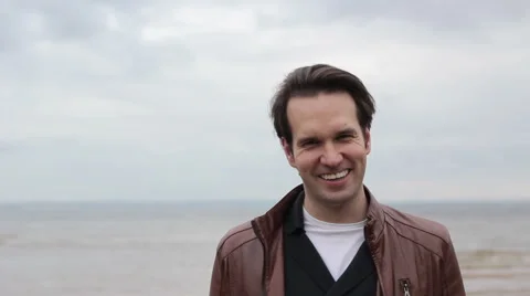 Guy  Smile and Laughs on Camera Ocean Background 스톡 동영상 53835547