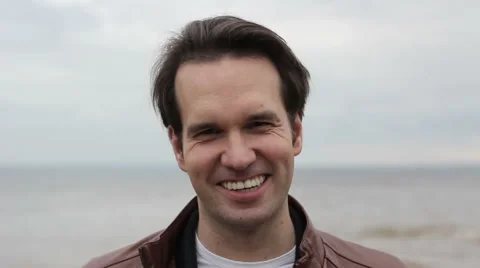 Guy  Smile and Laughs on Camera Ocean Background 스톡 동영상 53835955