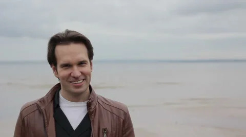 Guy  Smile on Camera Ocean Background Stock Footage 53848014