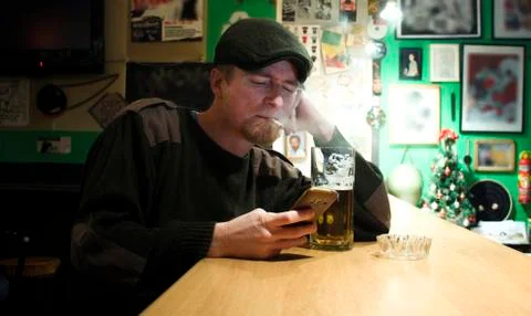 Guy smokes in the bar 스톡 사진