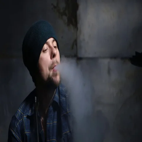 Guy smokes hookah and let smoke rings 스톡 동영상 69460242