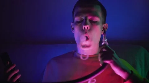 The guy smokes a hookah Stockbeeldmateriaal 145943830
