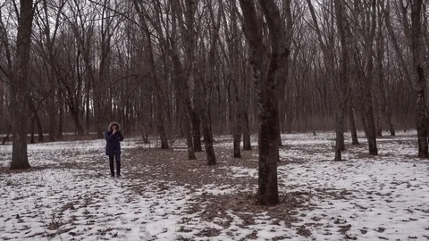 Guy smoking vape in winter forest Stock Footage 125177164