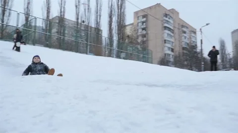 A guy in the snow goes down the snowy slope. Slow motion 01.10.2020 Ukraine Stock Footage 126642714