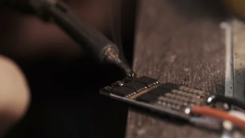 Guy soldering drone FPV wires with dirty fingernails Video stock 139546627