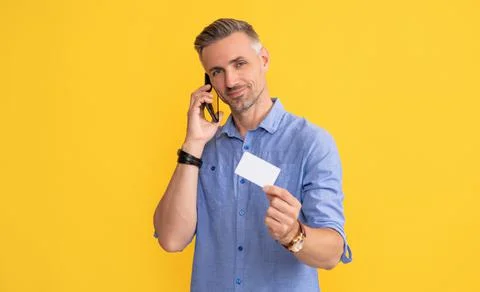 Guy speak on smartphone. customer use online money on mobile phone. Photos