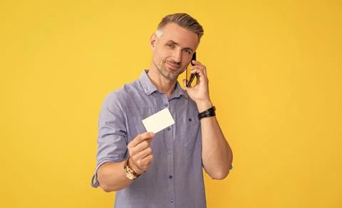 Guy speak on smartphone. customer use online money on mobile phone. Photos