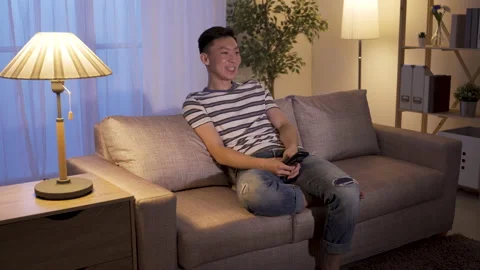 Guy spends leisure time watching funny dramas Video stock 133698673