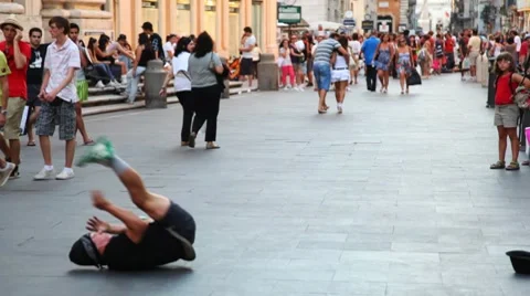 Guy is spinning and dancing breakdance in city center Video stock 7759579