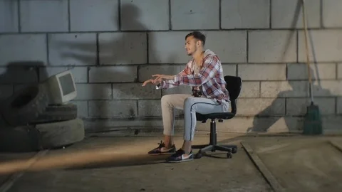 Guy is Spinning on a Chair  Stock Footage 95544615