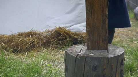 Guy splits a piece of wood Stock Footage 82403664