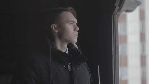 The guy is standing in an abandoned house Stock Footage 89875444