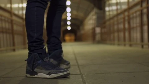 Guy is standing and starts to walk Stock Footage 80481012