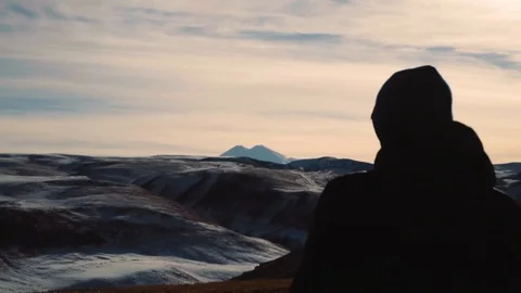The guy is standing on a background of Mountain Ranges Stock Footage 101691391