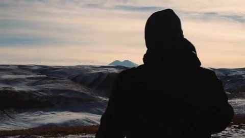 The guy is standing on a background of Mountain Ranges Stock Footage 101691405