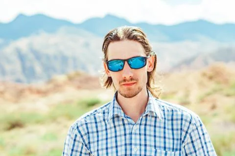 The guy standing on a background of mountains Stock Photos