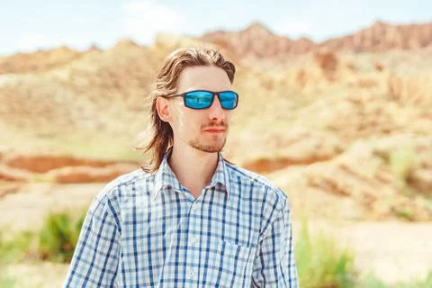 The guy standing on a background of mountains Stock Photos